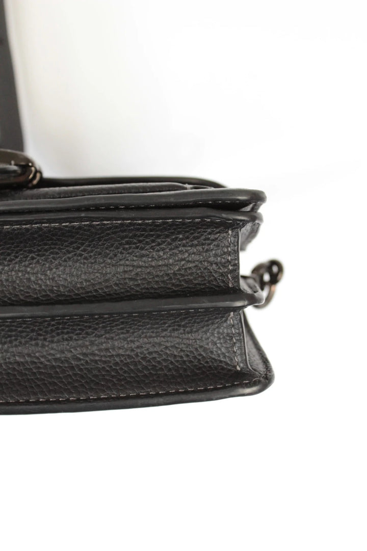 Coach black Tabby 20 clutch bag in polished pebble leather with pewter C logo hardware.