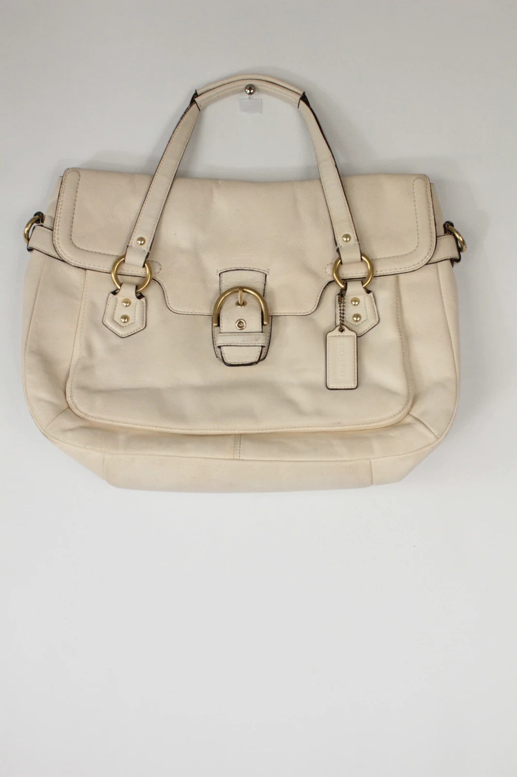 Coach cream leather satchel bag with gold-tone buckle clasp and matching hangtag.