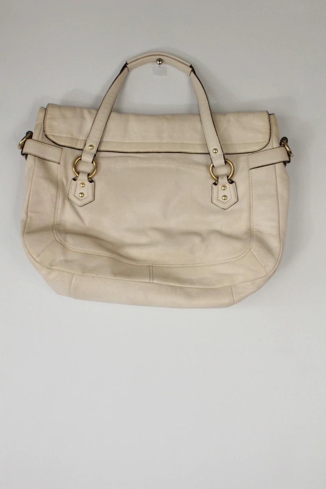 Coach cream leather satchel bag with gold-tone buckle clasp and matching hangtag.