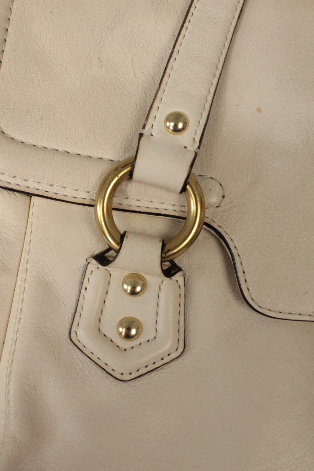 Coach cream leather satchel bag with gold-tone buckle clasp and matching hangtag.