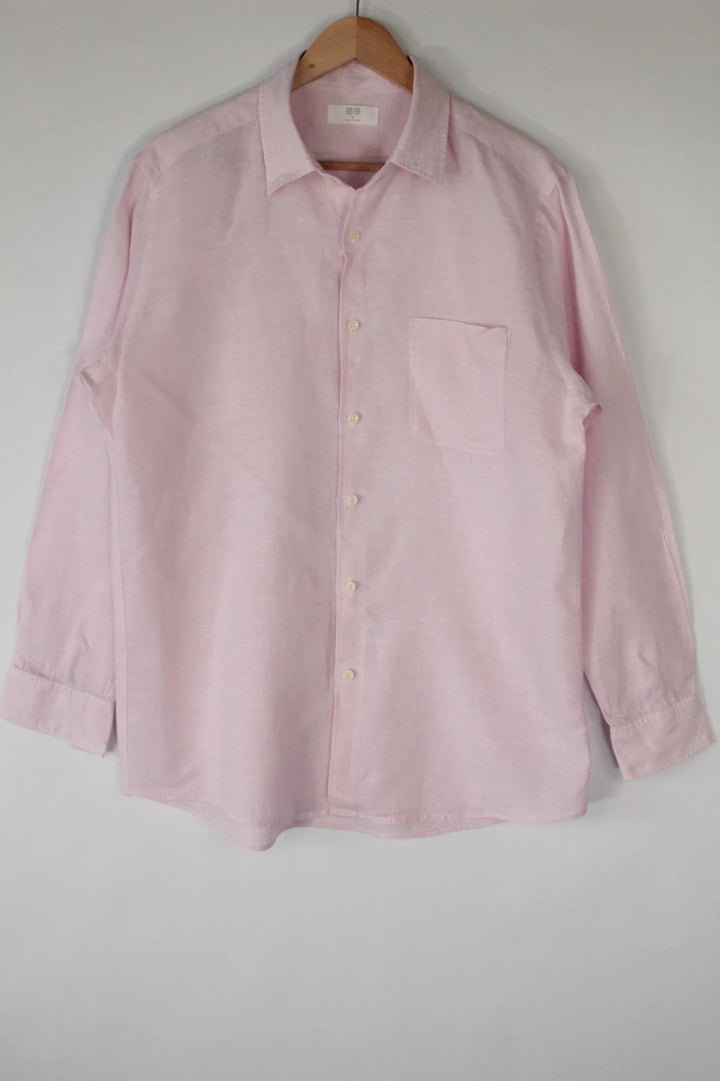 Uniqlo light pink long sleeve linen shirt with classic white buttons and chest pocket.