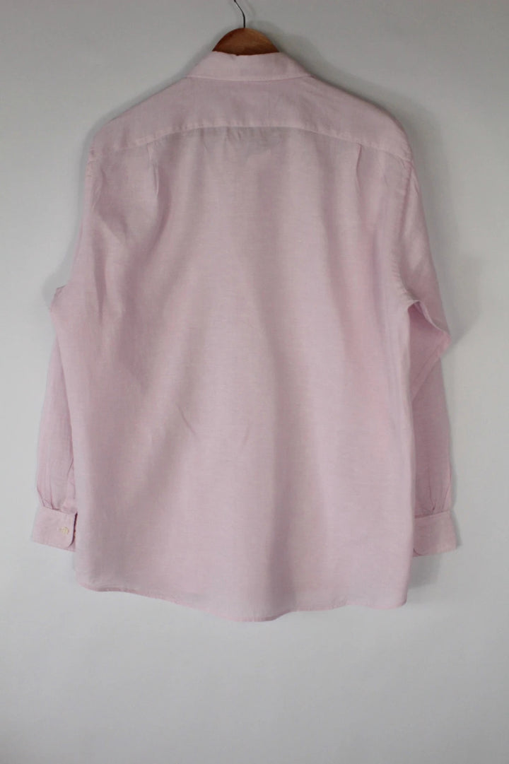 Uniqlo light pink long sleeve linen shirt with classic white buttons and chest pocket.