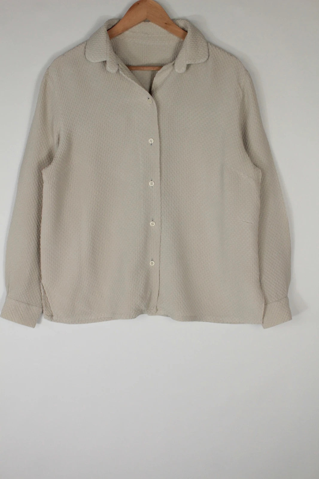Vintage Dressing beige crinkle blouse with textured waffle fabric and classic button-up front.