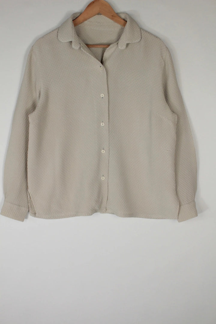Vintage Dressing beige crinkle blouse with textured waffle fabric and classic button-up front.