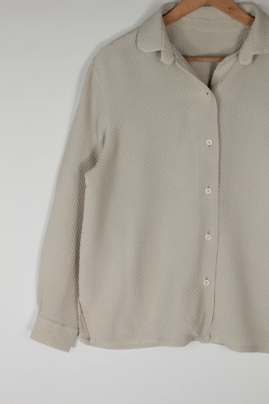 Vintage Dressing beige crinkle blouse with textured waffle fabric and classic button-up front.