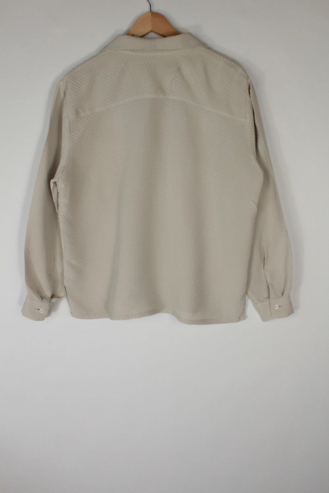 Vintage Dressing beige crinkle blouse with textured waffle fabric and classic button-up front.