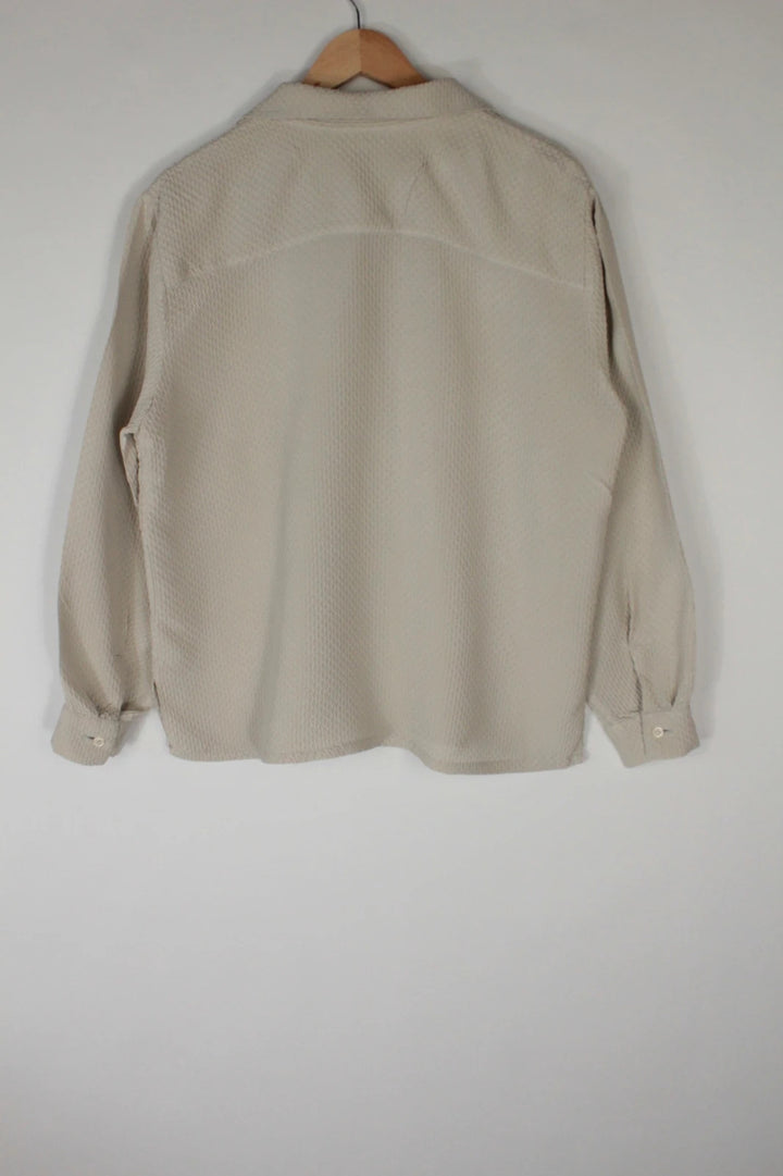 Vintage Dressing beige crinkle blouse with textured waffle fabric and classic button-up front.