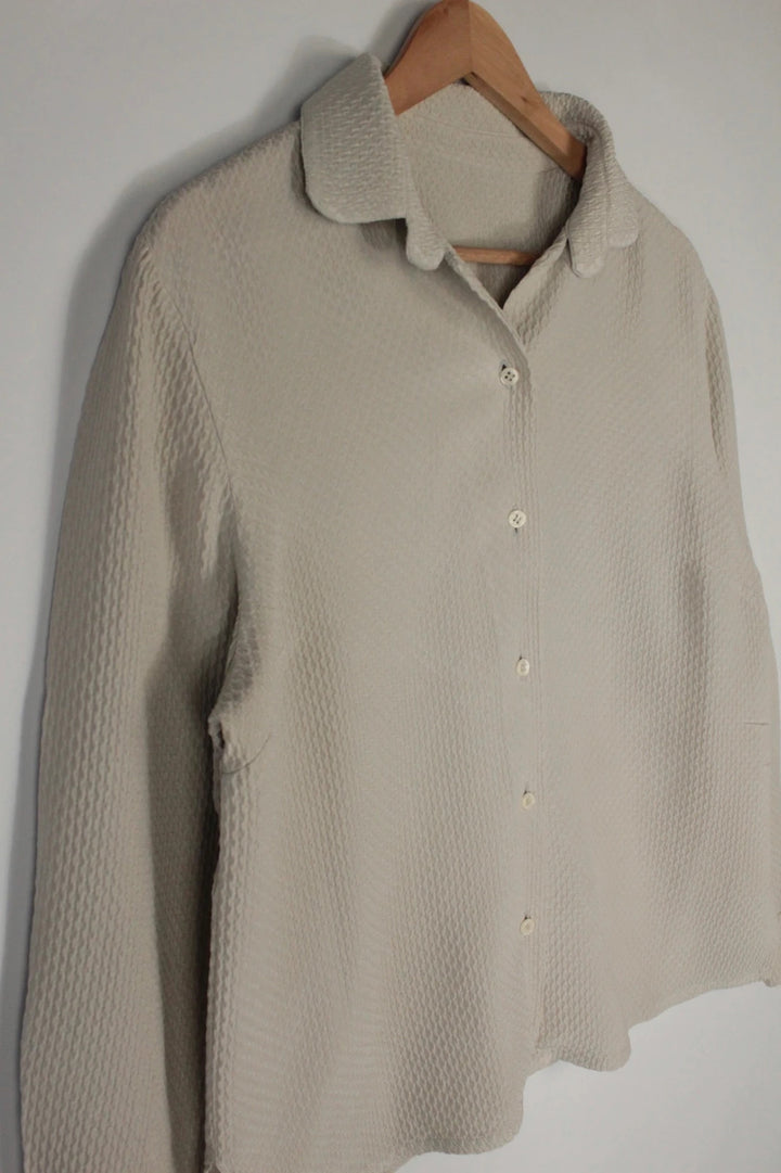 Vintage Dressing beige crinkle blouse with textured waffle fabric and classic button-up front.