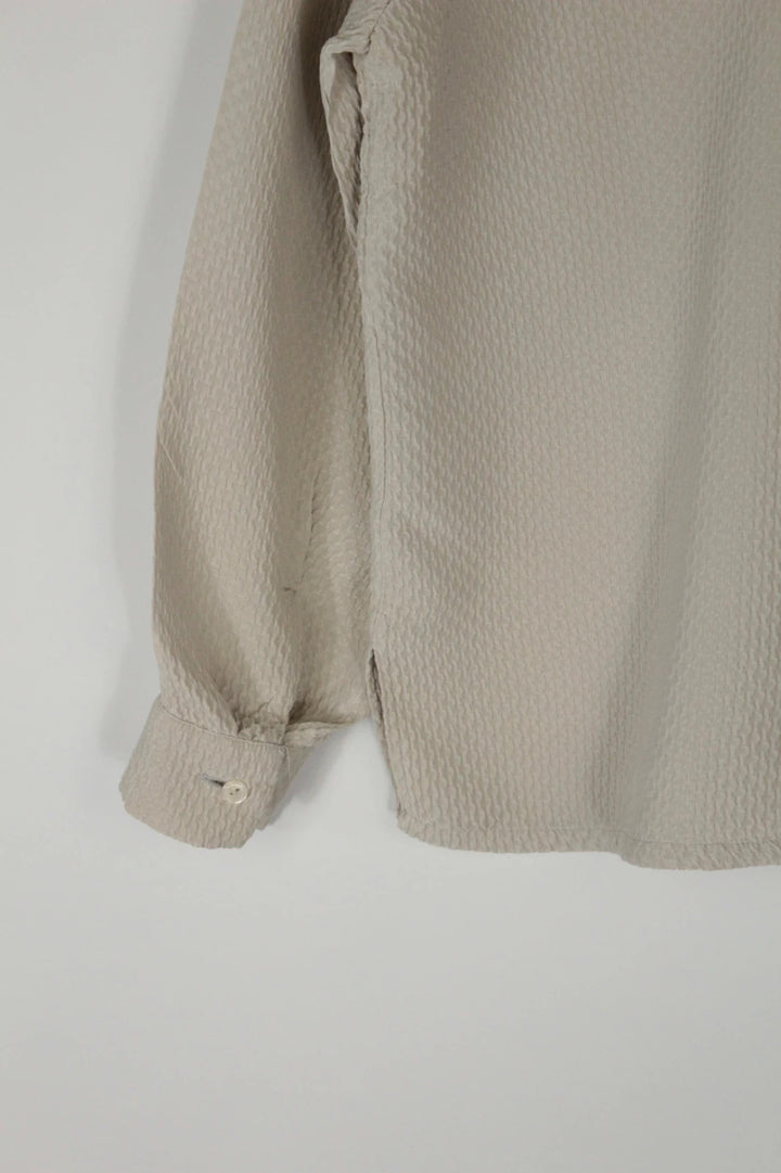 Vintage Dressing beige crinkle blouse with textured waffle fabric and classic button-up front.