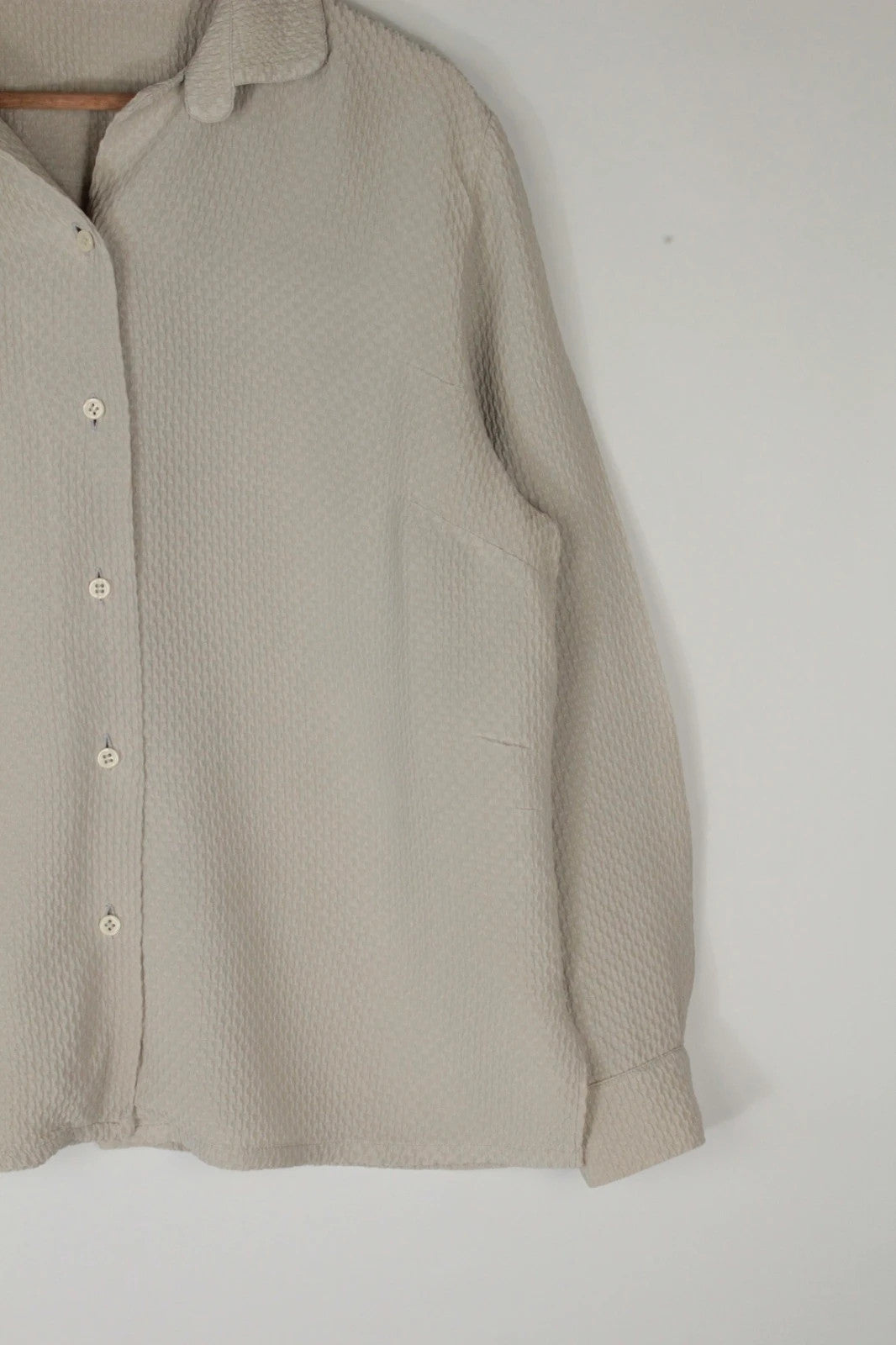 Vintage Dressing beige crinkle blouse with textured waffle fabric and classic button-up front.
