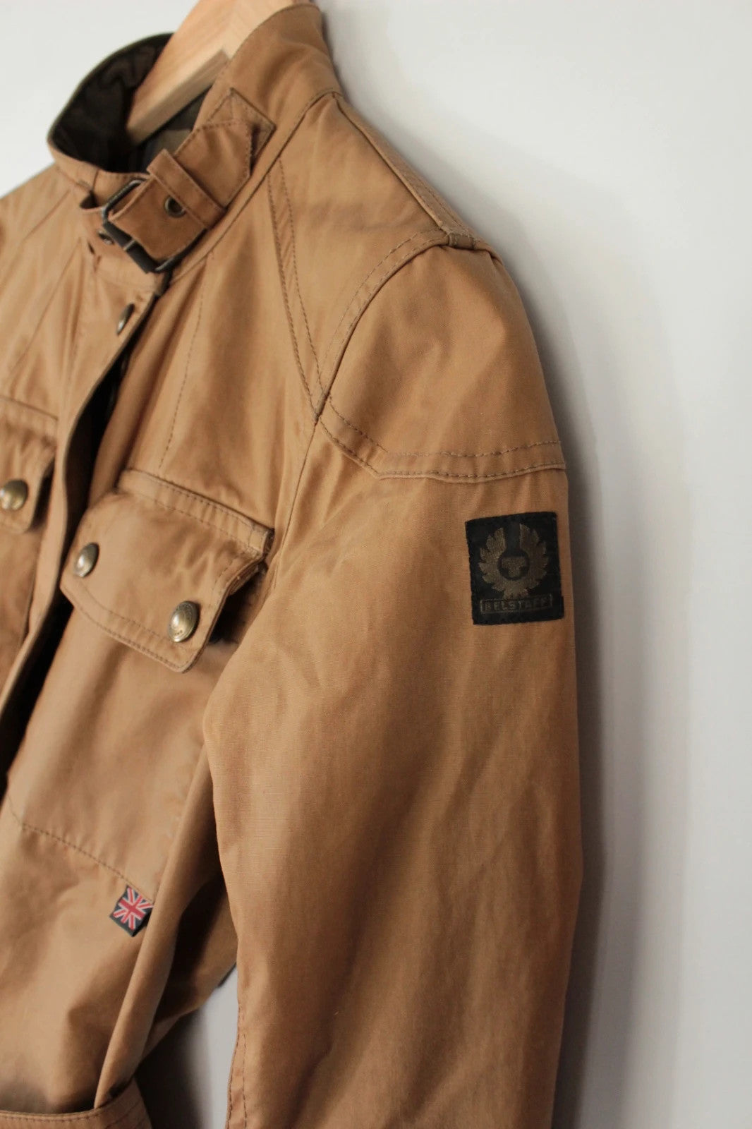 Belstaff brown waxed cotton motorcycle jacket with corduroy collar and matching waist belt.