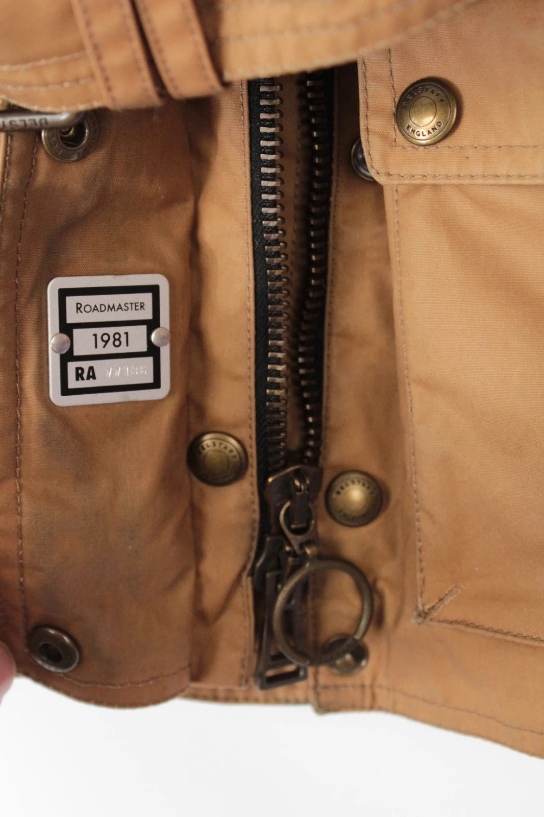 Belstaff brown waxed cotton motorcycle jacket with corduroy collar and matching waist belt.