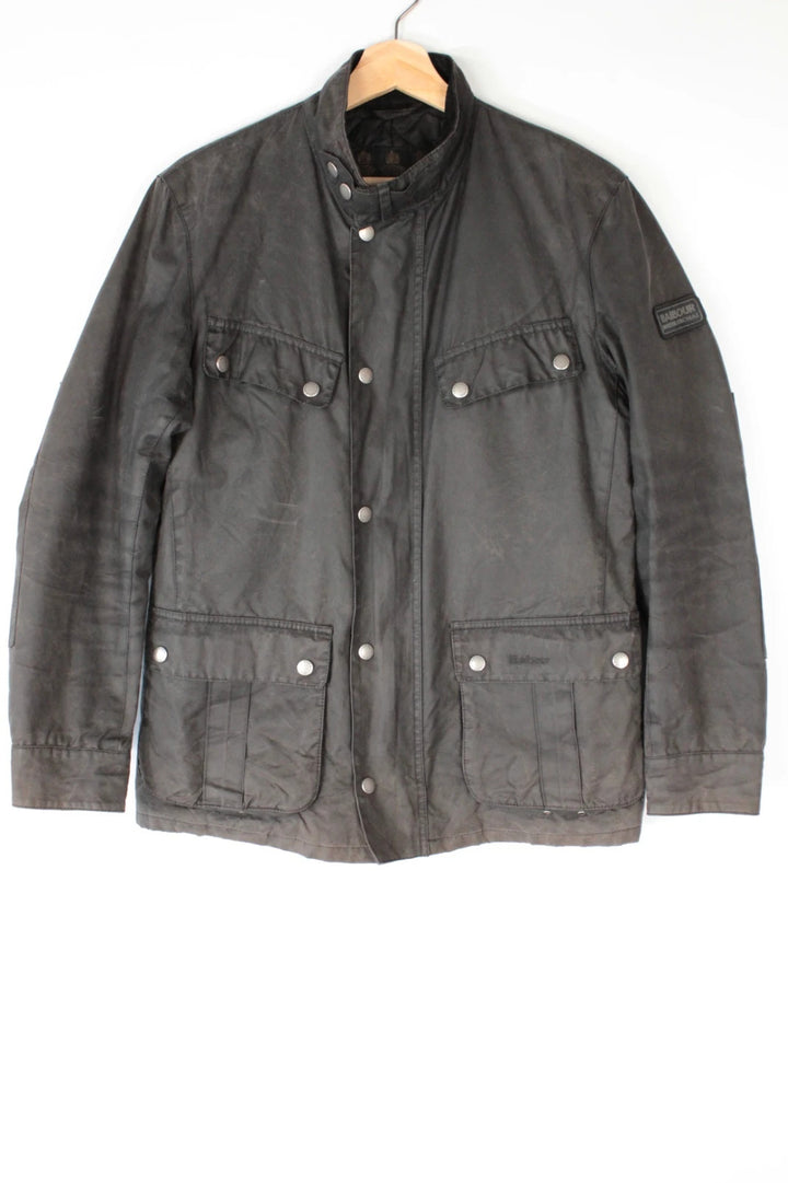 Barbour black waxed cotton motorcycle jacket with corduroy trim and vintage patina.