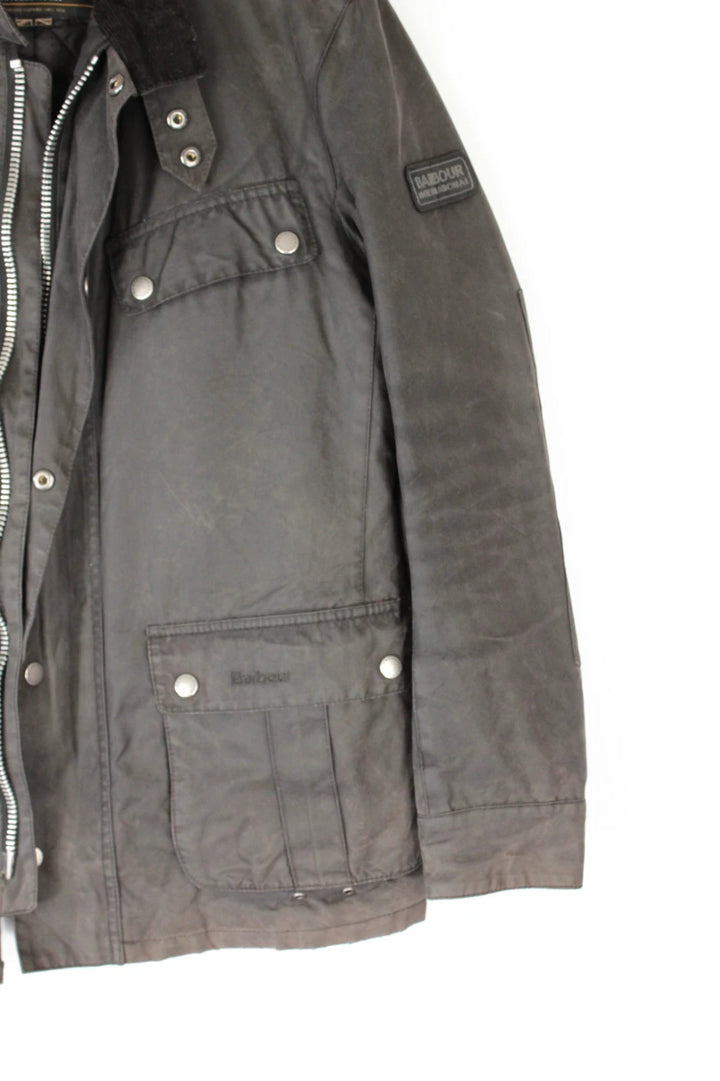 Barbour black waxed cotton motorcycle jacket with corduroy trim and vintage patina.