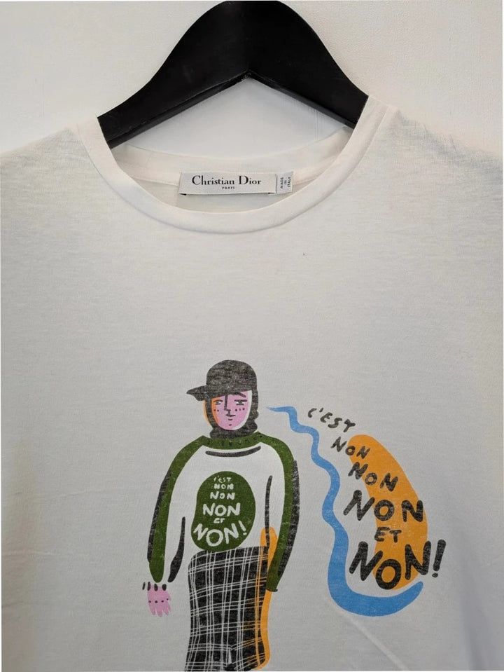 Christian Dior white pocket t-shirt with graphic protest illustration and bee motif.