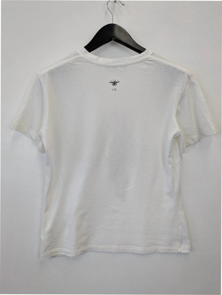 Christian Dior white pocket t-shirt with graphic protest illustration and bee motif.