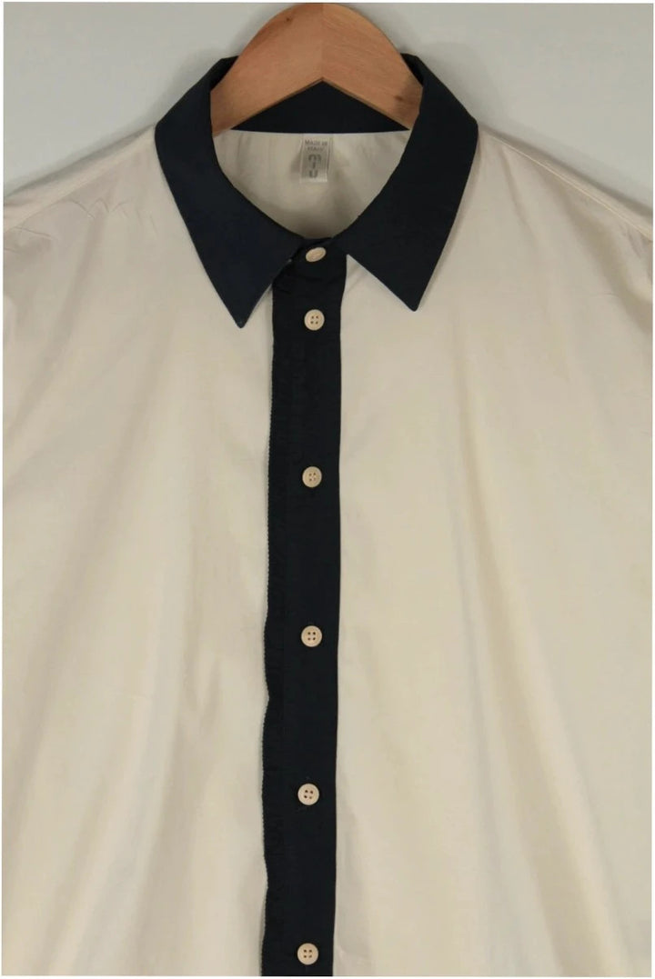 Miu Miu cream and navy collared blouse with contrast trim and premium cotton blend.