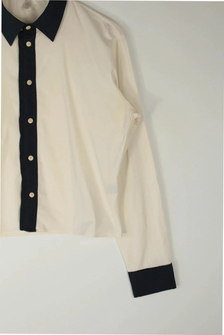 Miu Miu cream and navy collared blouse with contrast trim and premium cotton blend.