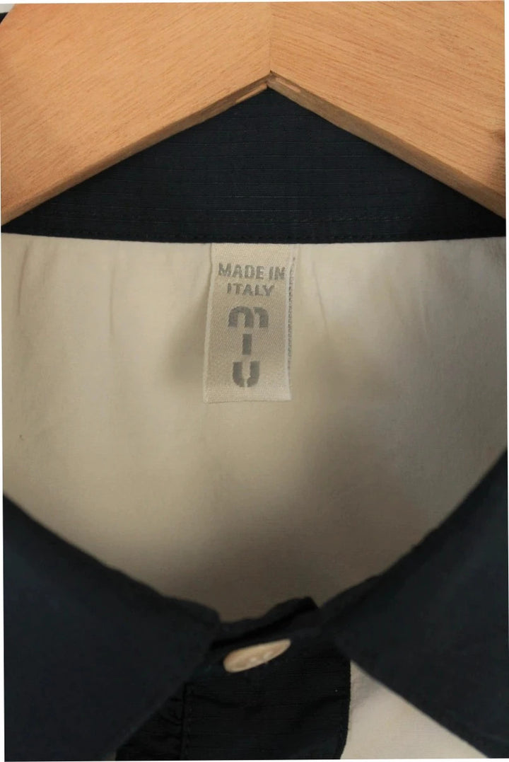 Miu Miu cream and navy collared blouse with contrast trim and premium cotton blend.