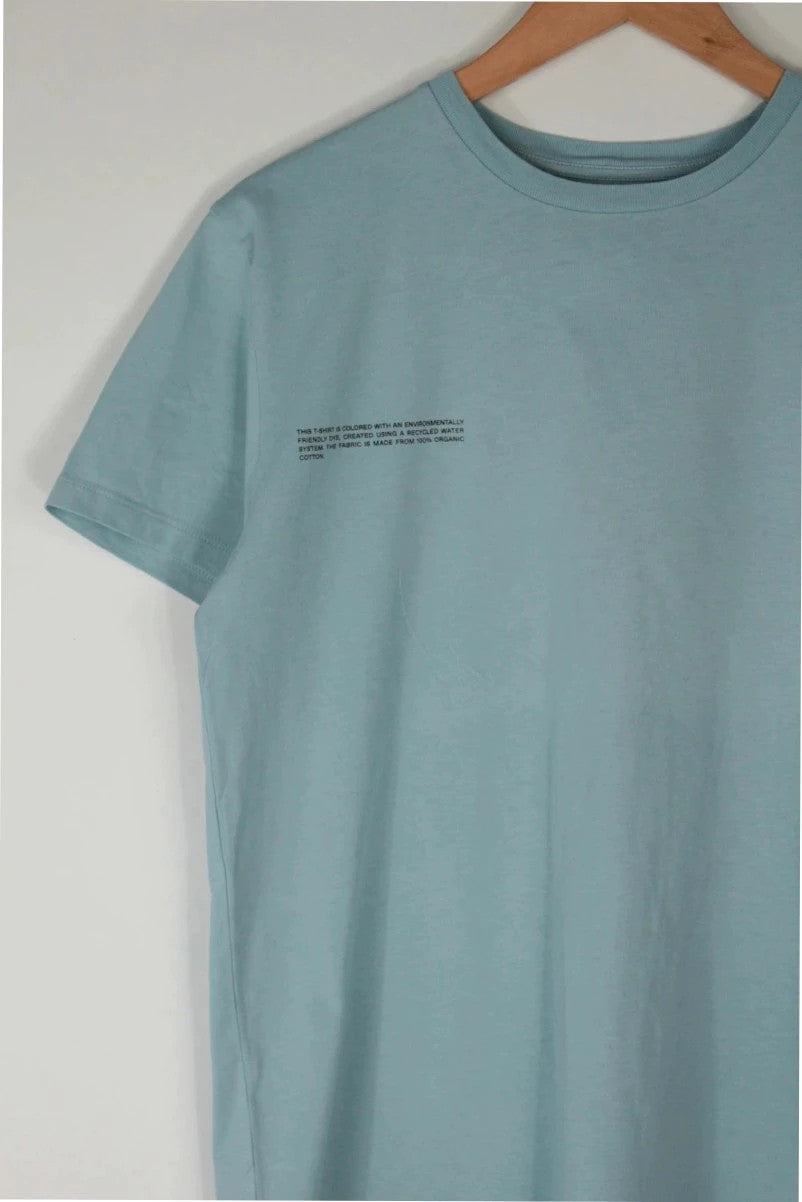 Pangaia light blue mint green pocket t-shirt with minimalist text block design.