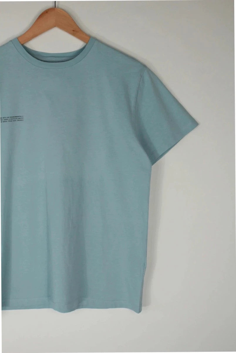 Pangaia light blue mint green pocket t-shirt with minimalist text block design.