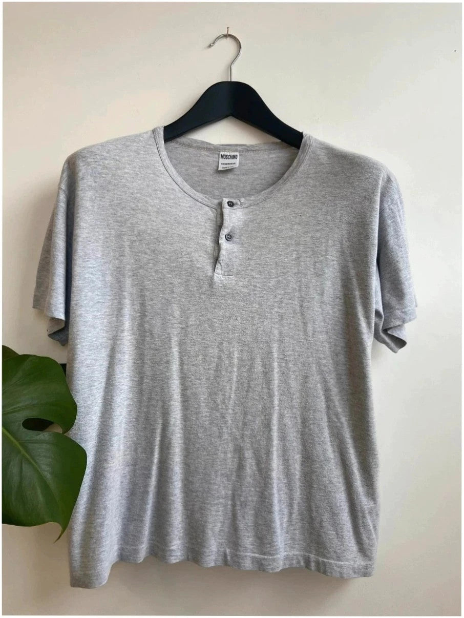 Moschino grey cotton polo shirt with rounded neckline and two front buttons, vintage style.