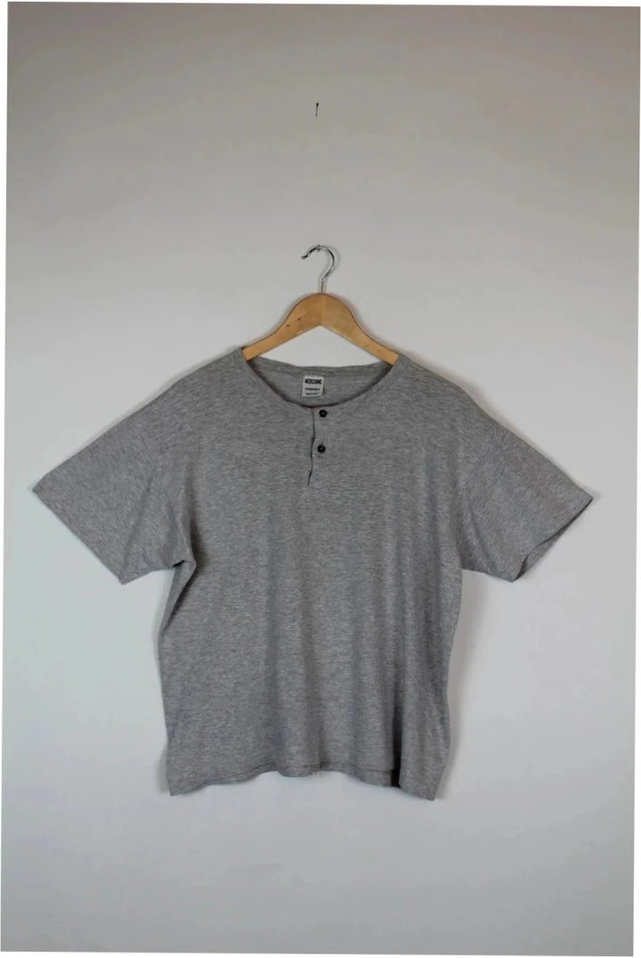 Moschino grey cotton polo shirt with rounded neckline and two front buttons, vintage style.