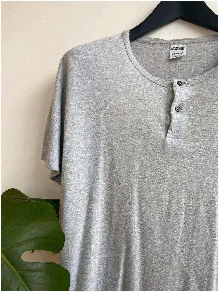 Moschino grey cotton polo shirt with rounded neckline and two front buttons, vintage style.