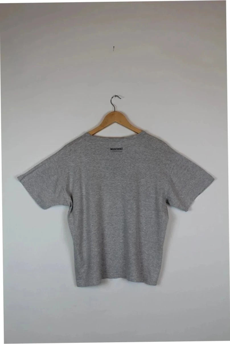Moschino grey cotton polo shirt with rounded neckline and two front buttons, vintage style.