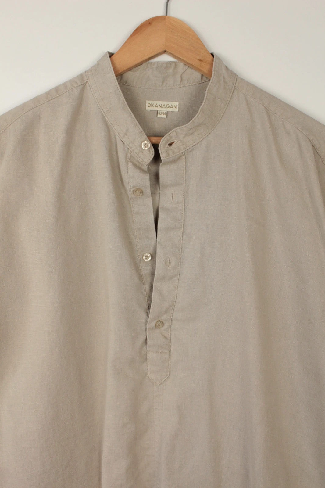 Okanagan men's popover shirt beige khaki lightweight linen with grandfather collar and button detailing.