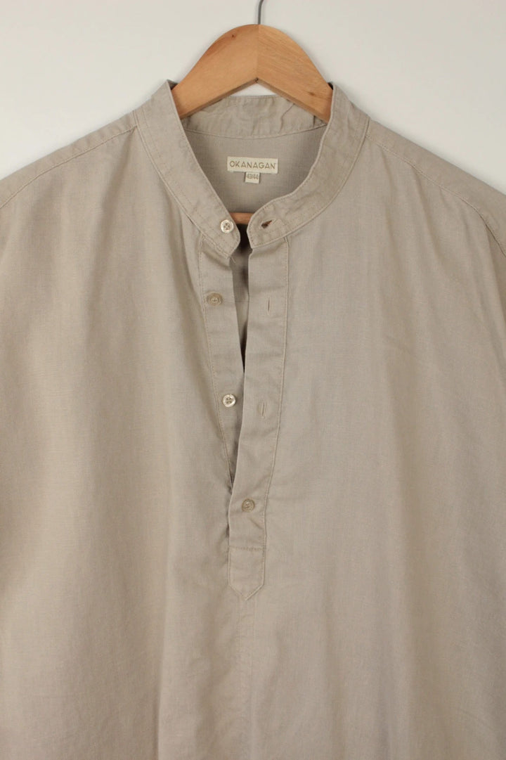 Okanagan men's popover shirt beige khaki lightweight linen with grandfather collar and button detailing.