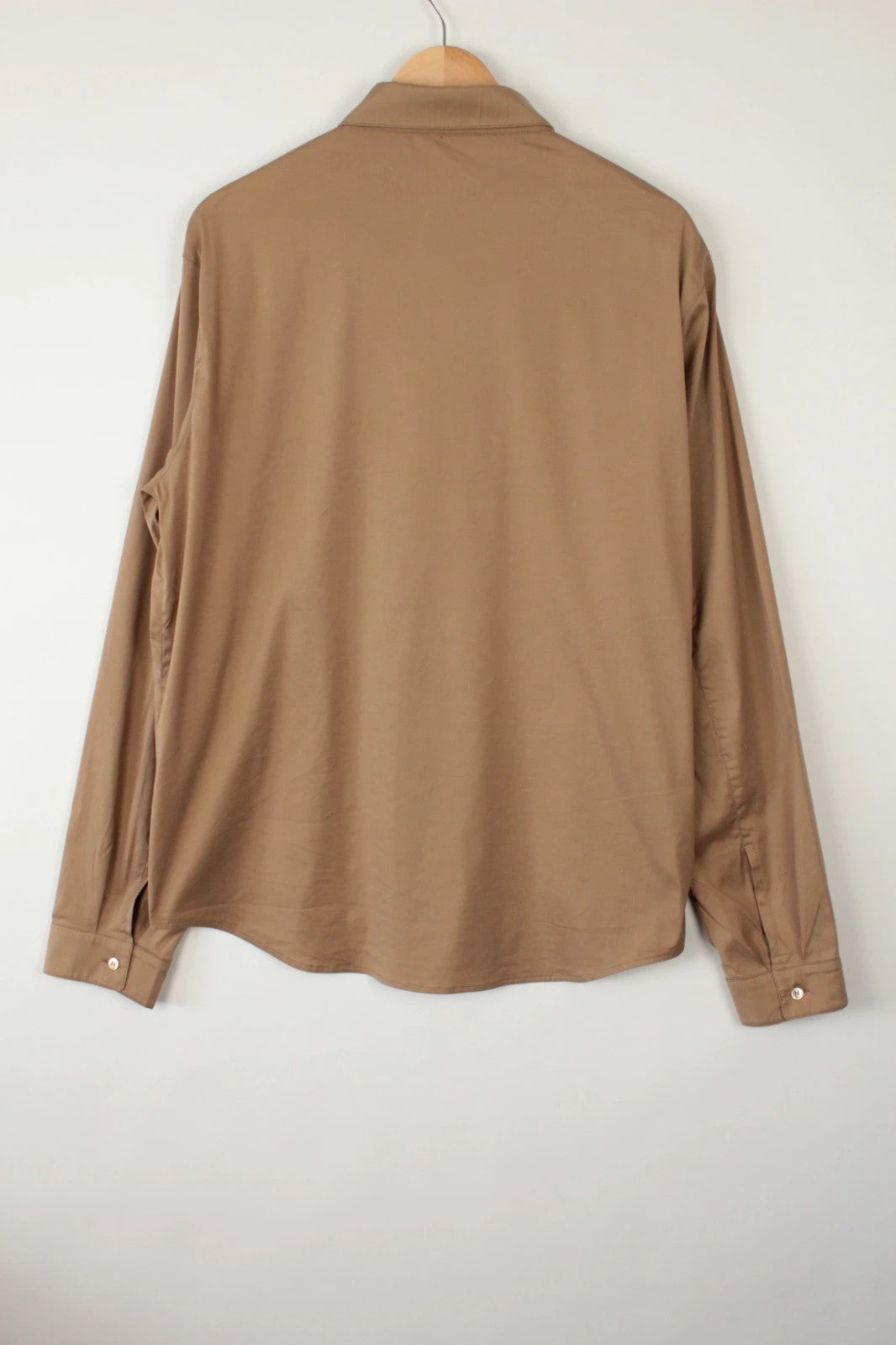Prada beige stretch cotton shirt with hidden placket and sharp pointed collar.