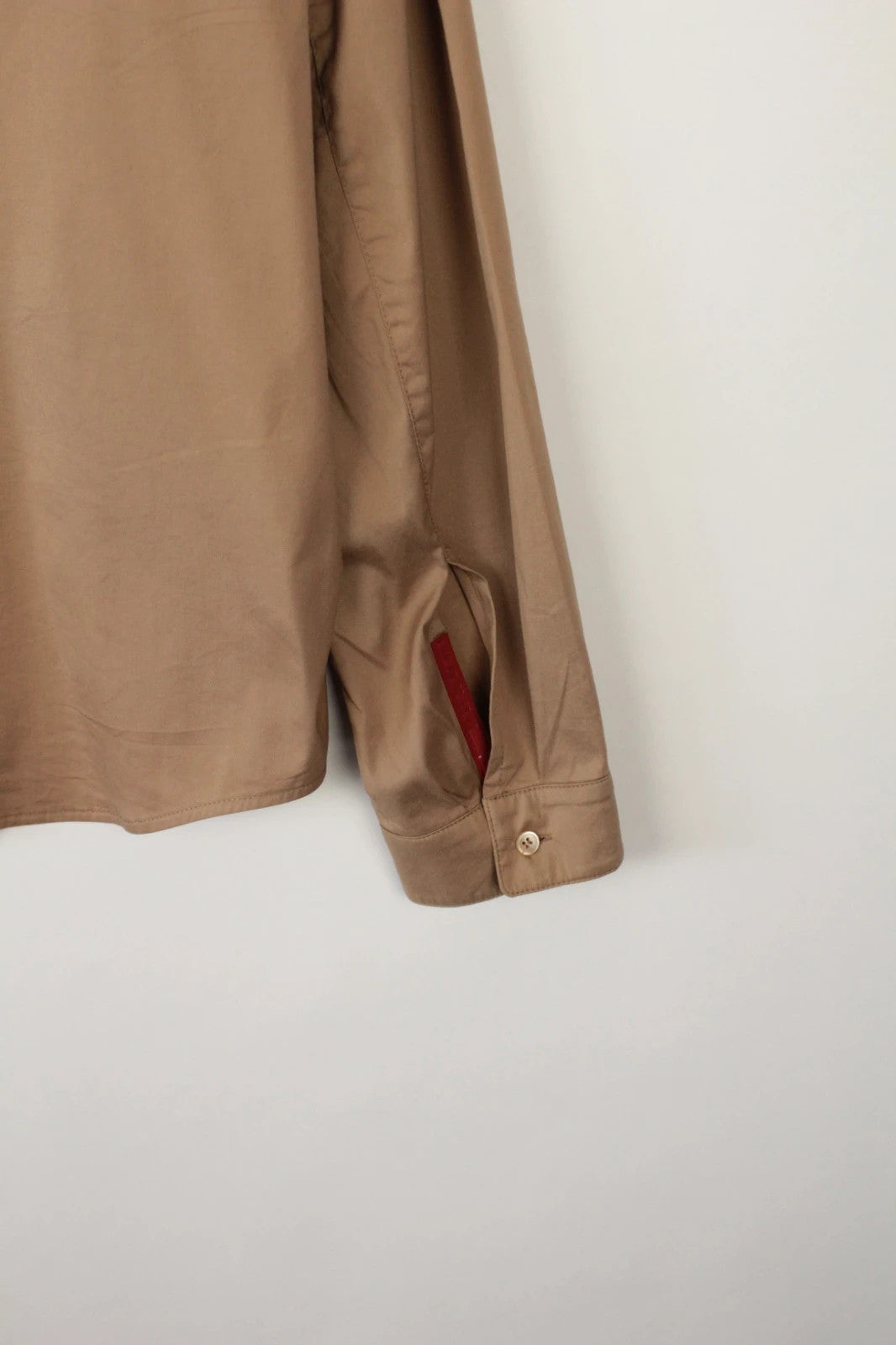 Prada beige stretch cotton shirt with hidden placket and sharp pointed collar.