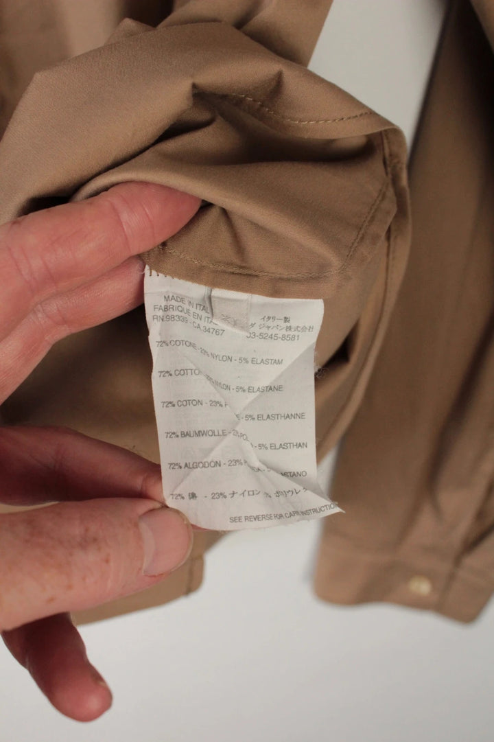 Prada beige stretch cotton shirt with hidden placket and sharp pointed collar.