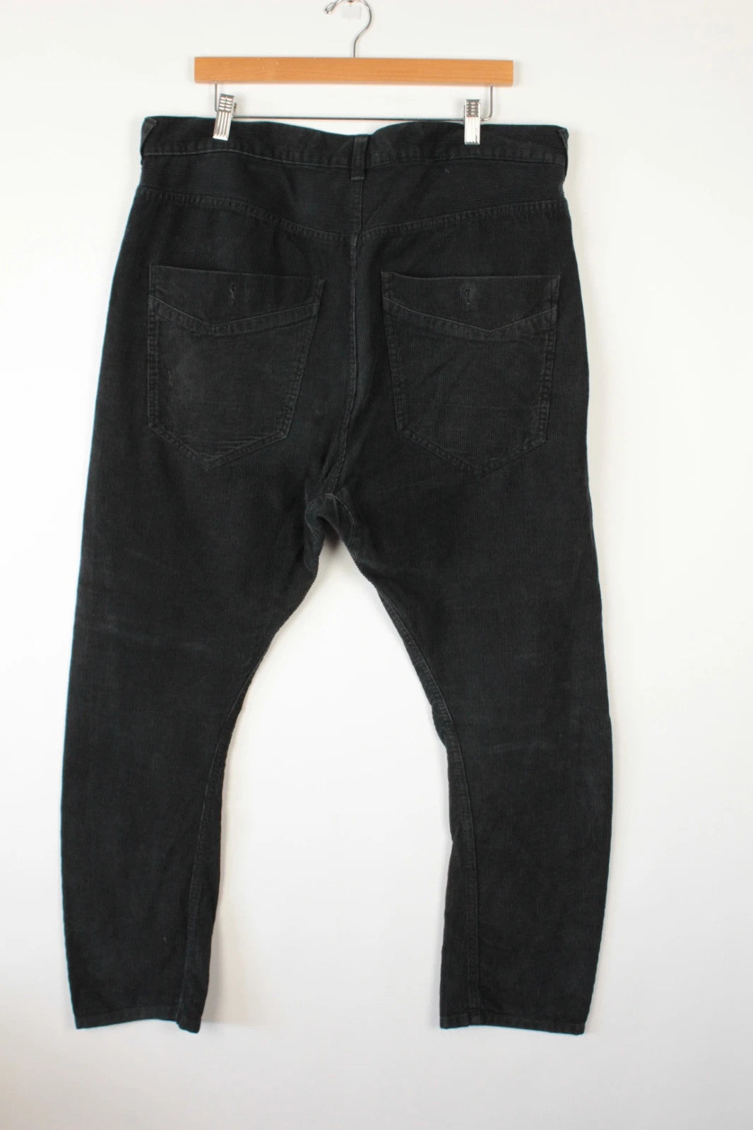 Denim & Co. black wide-leg trousers with drop-crotch design and oversized utility pockets.