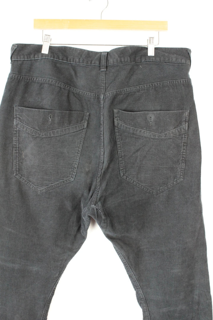 Denim & Co. black wide-leg trousers with drop-crotch design and oversized utility pockets.