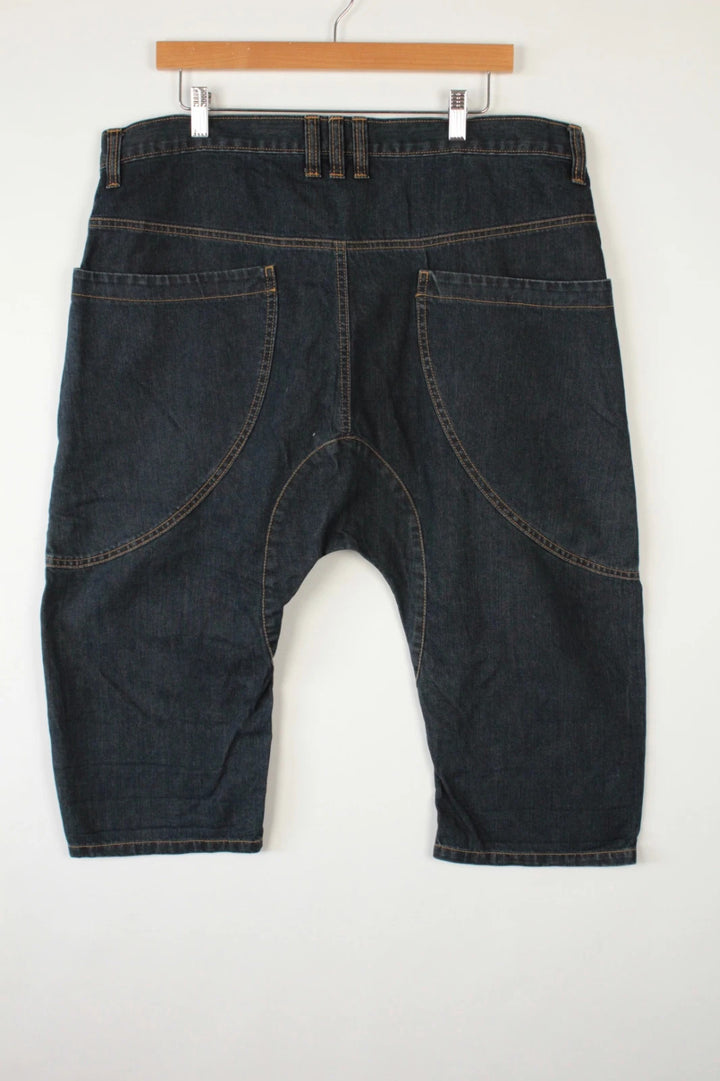 Aqua navy drop crotch 3/4 denim shorts with curved pockets and contrast tobacco stitching.