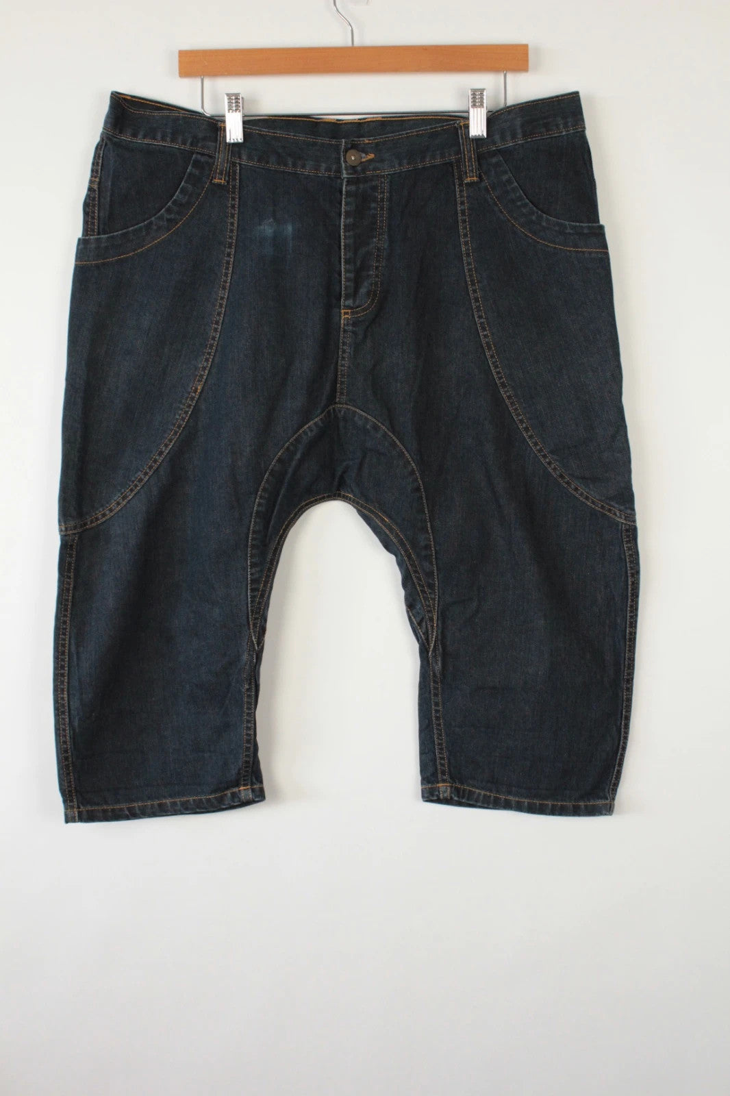 Aqua navy drop crotch 3/4 denim shorts with curved pockets and contrast tobacco stitching.