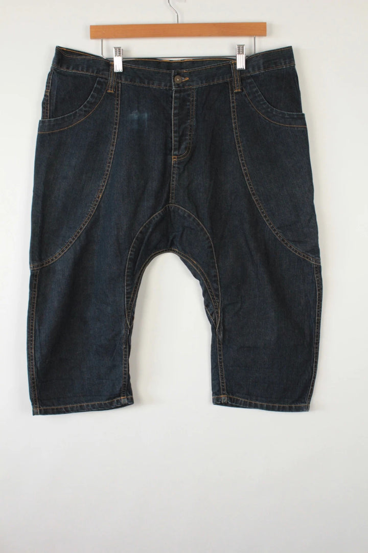 Aqua navy drop crotch 3/4 denim shorts with curved pockets and contrast tobacco stitching.