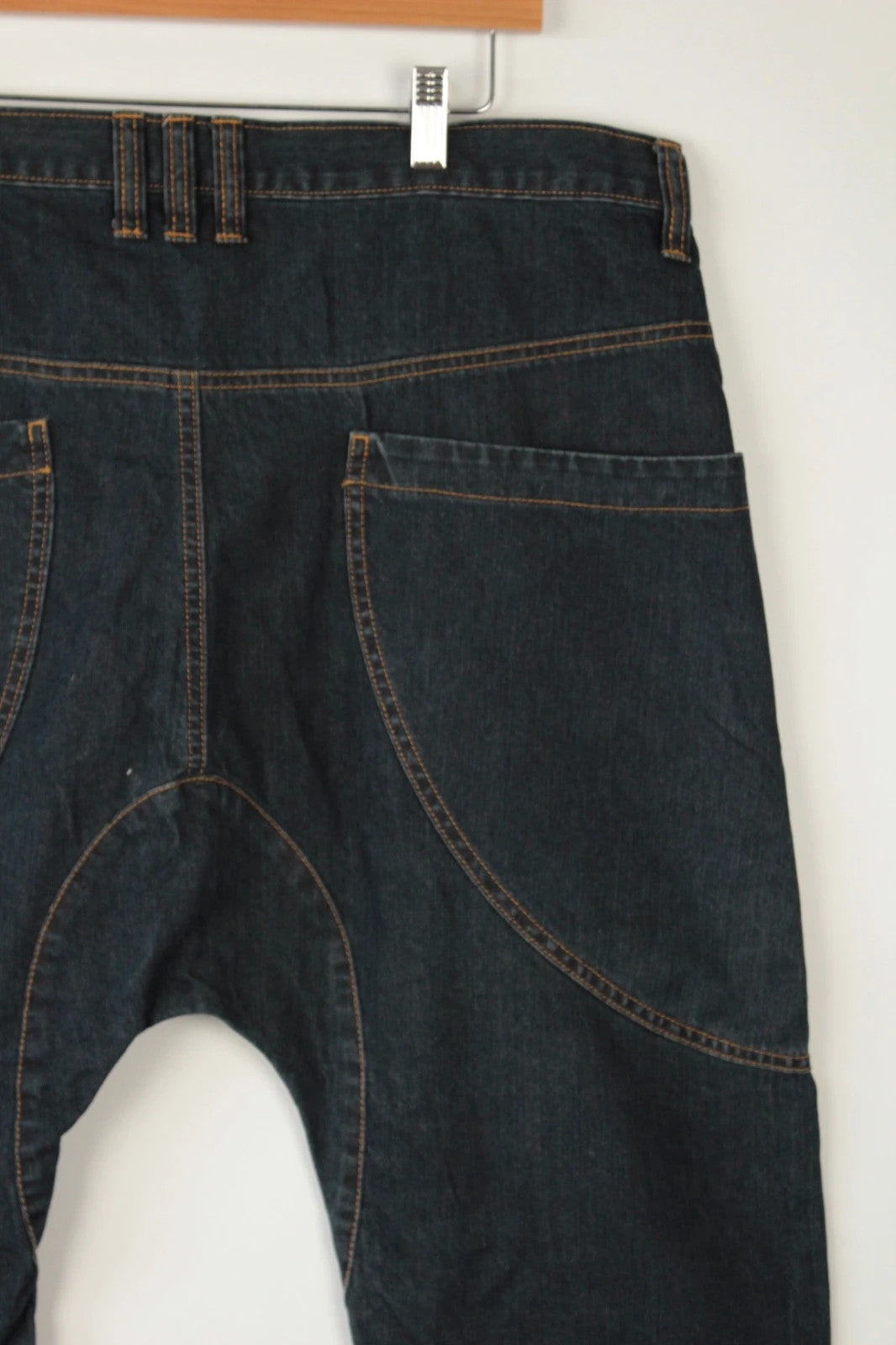 Aqua navy drop crotch 3/4 denim shorts with curved pockets and contrast tobacco stitching.