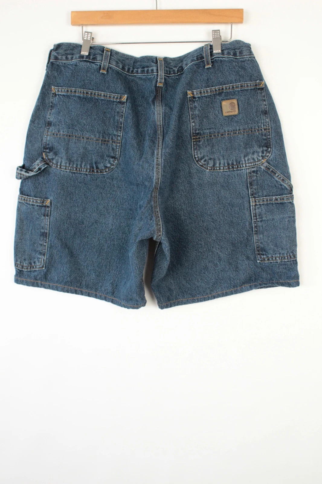 Carhartt blue denim shorts with elastic drawstring waist and leatherette logo patch.