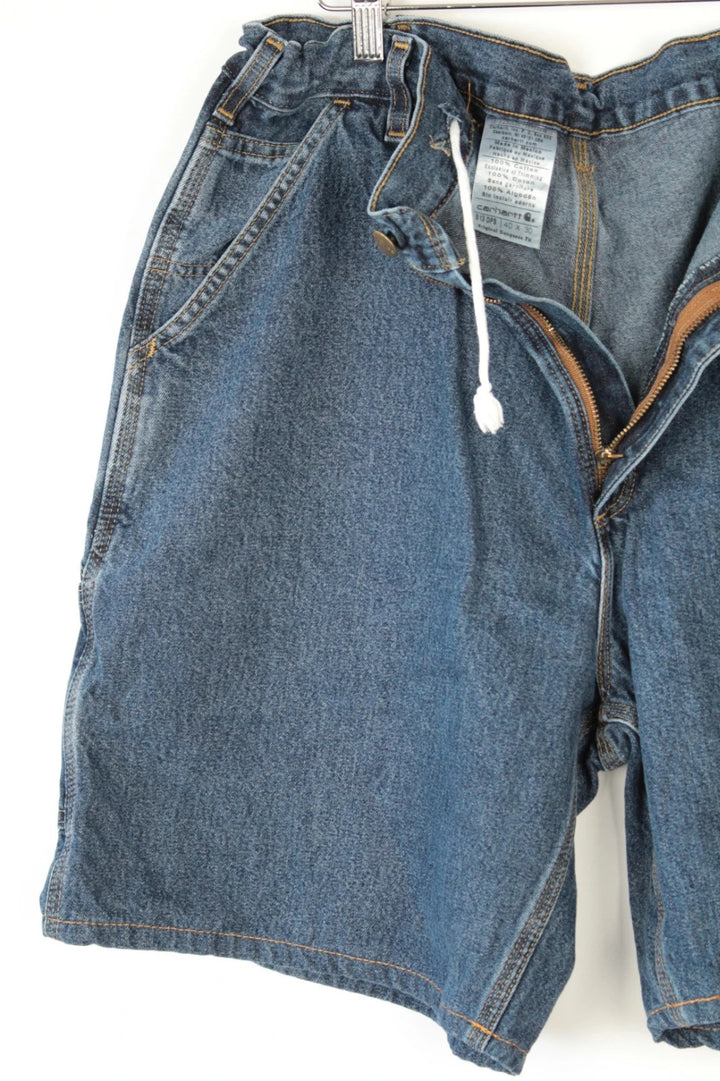 Carhartt blue denim shorts with elastic drawstring waist and leatherette logo patch.
