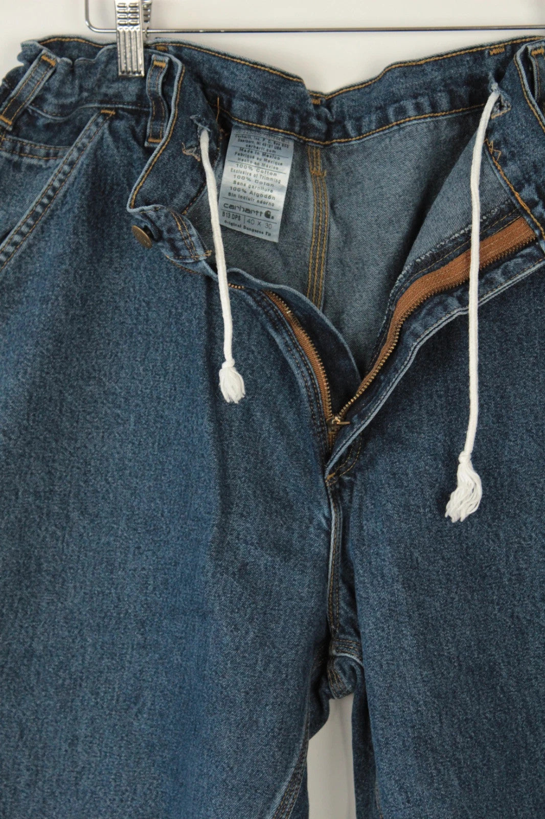 Carhartt blue denim shorts with elastic drawstring waist and leatherette logo patch.