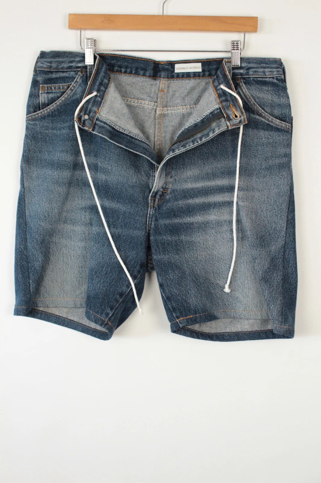 Dickies blue denim shorts with elastic drawstring waist and woven horseshoe logo patch.