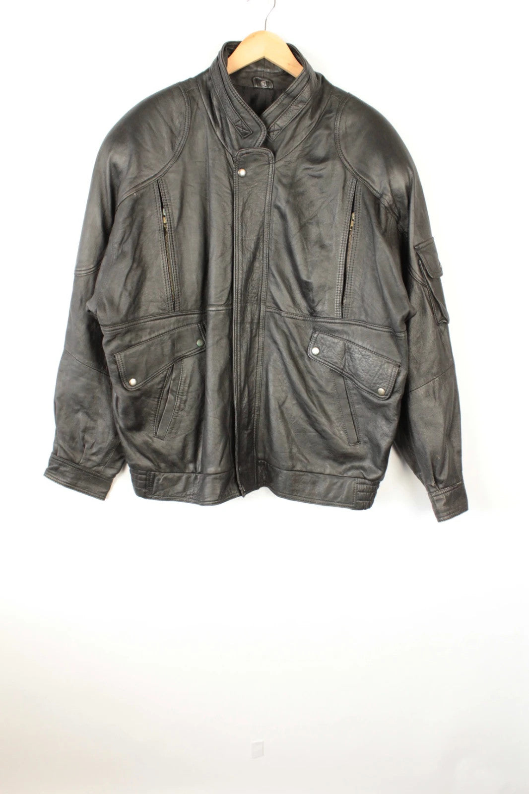 Vintage Dressing black bomber jacket, genuine leather, heavyweight, with utility arm pocket and satin lining.