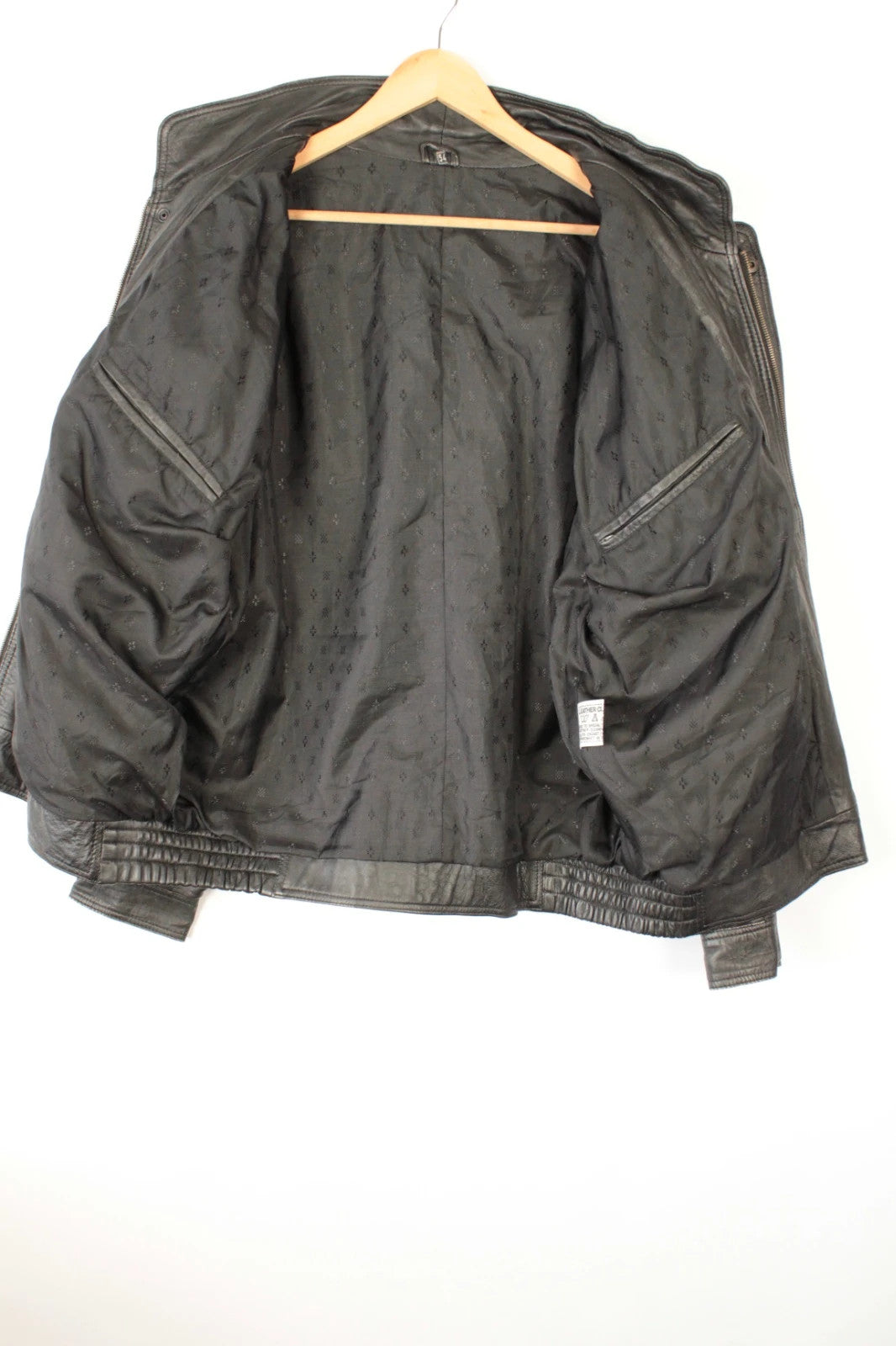 Vintage Dressing black bomber jacket, genuine leather, heavyweight, with utility arm pocket and satin lining.