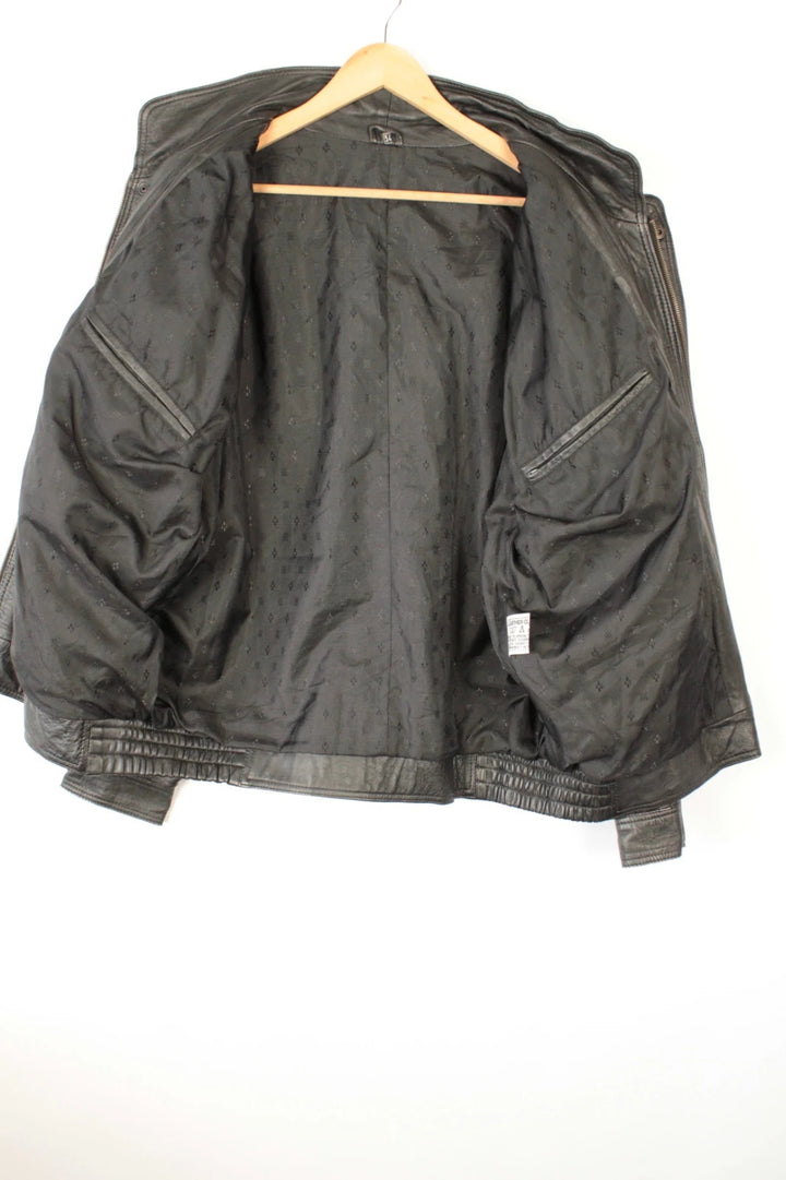 Vintage Dressing black bomber jacket, genuine leather, heavyweight, with utility arm pocket and satin lining.