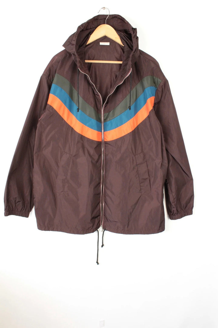 Dries Van Noten brown windbreaker jacket with multi-coloured chevron stripes and silver zipper.