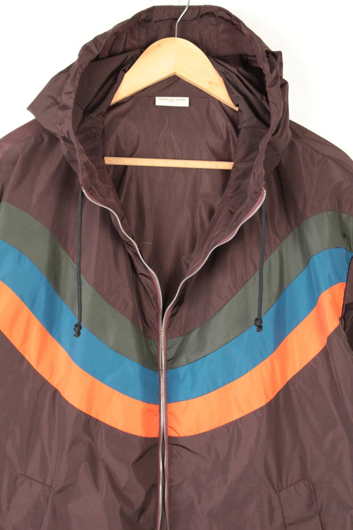 Dries Van Noten brown windbreaker jacket with multi-coloured chevron stripes and silver zipper.