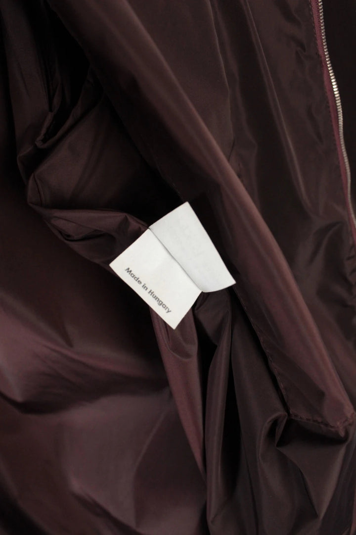 Dries Van Noten brown windbreaker jacket with multi-coloured chevron stripes and silver zipper.